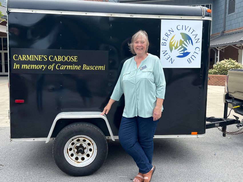 Eileen Buscemi standing next to black tool trailer