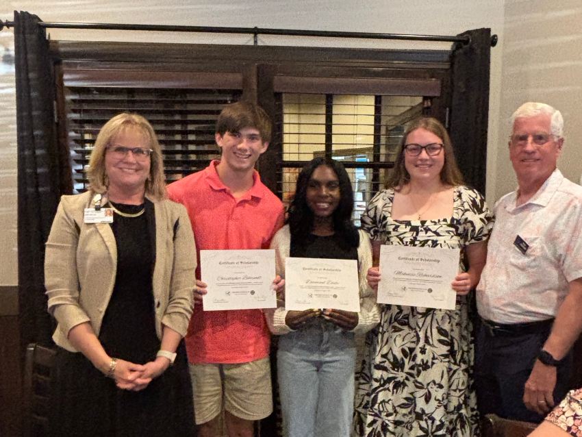 group photo of 3 high school seniors and two adults